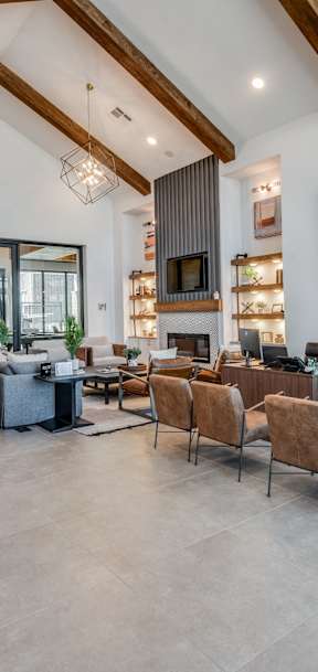 A modern living room with a grey sofa and a wooden coffee table.