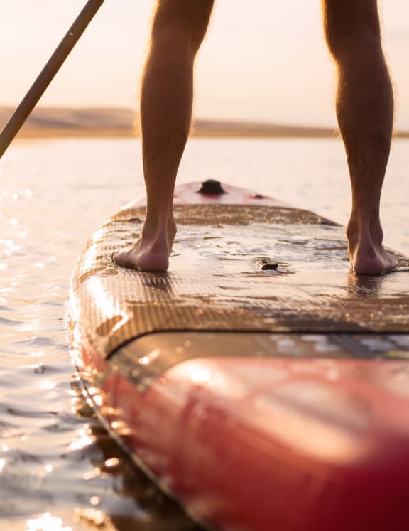 Man Standing on Stand Up Paddleboard