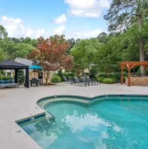 the swimming pool at the preserve at polo garden apartments tx