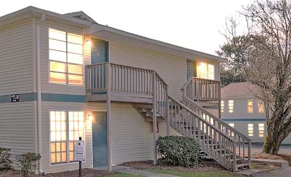 A two story building with a staircase leading to the second story.