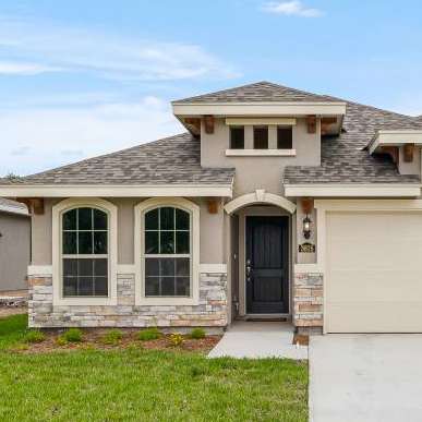 A modern house with a garage and a driveway.