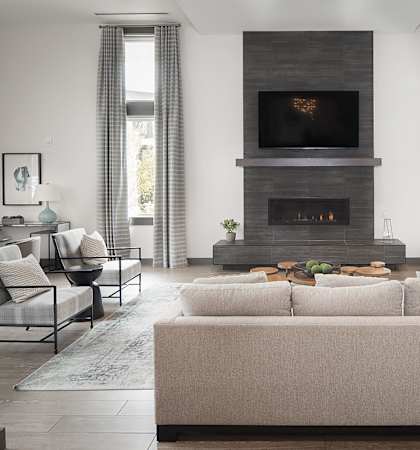 a living room with a couch and a fireplace