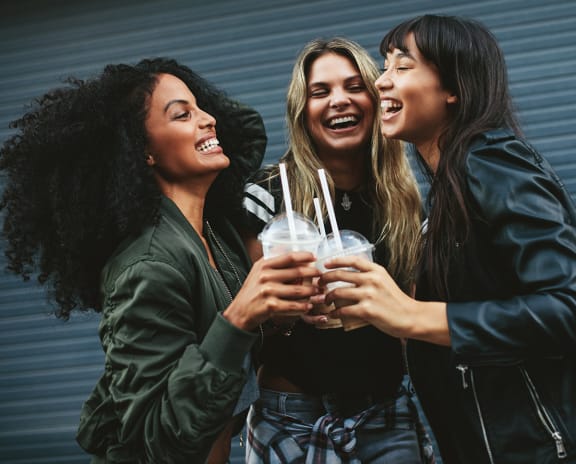 a group of women drinking beer