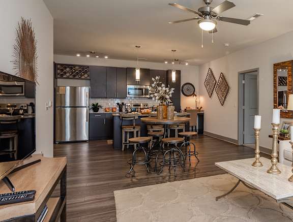 a living room with a couch and a table at Altis Twin Lakes Apartments, Kissimmee, Florida