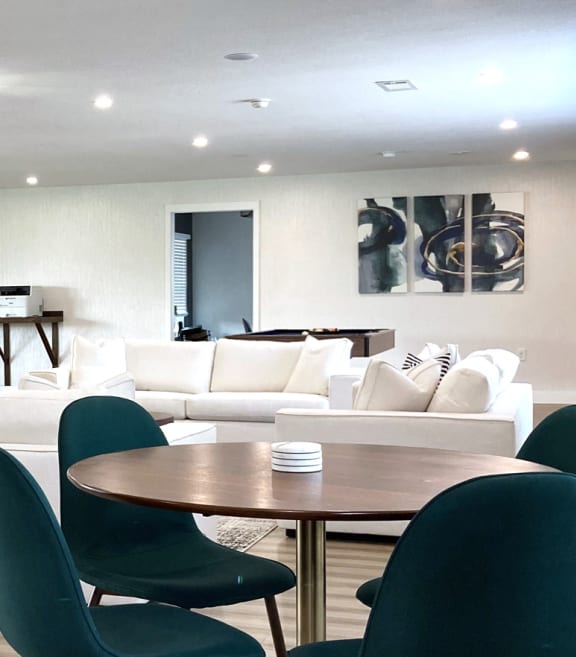 a living room and dining room with a couch and a table