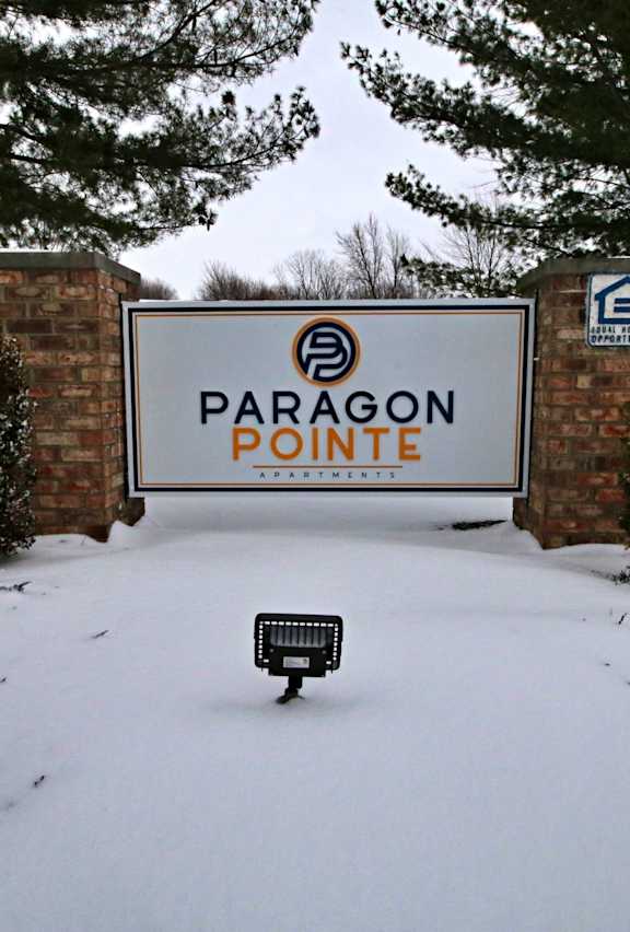 a sign for paragon pointe apartments