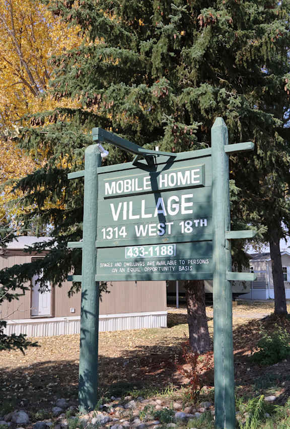 the sign for mobile home village in front of a house at Mobile Home Village, Cheyenne, Wyoming