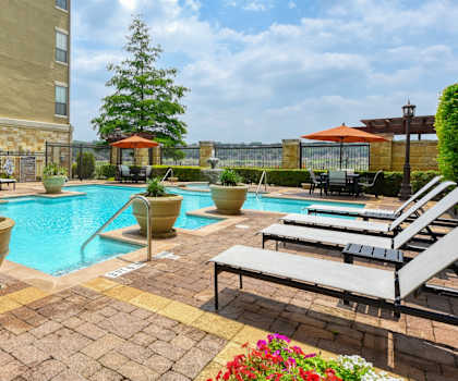 our apartments have a resort style pool and lounge chairs