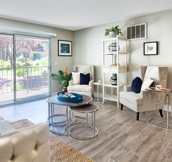 a living room with furniture and a sliding glass door  at Mountain Vista, Victorville, 92395