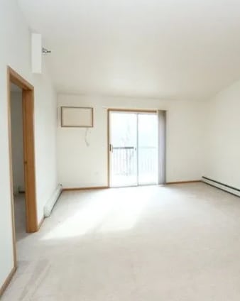 A room with a window and a door.