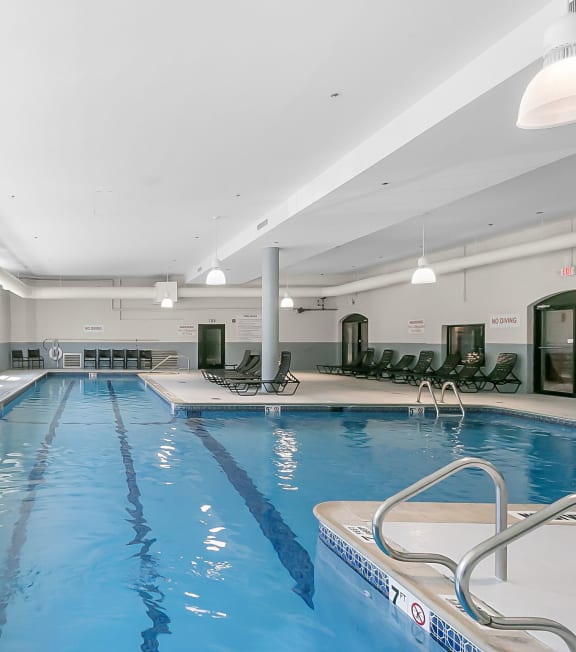 a yellow pool float in a swimming pool at Clocktower and Velvet Mill Apartments, Connecticut
