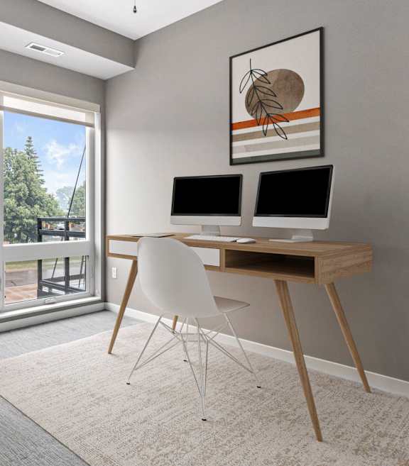 a kitchen and dining area with a wooden table and chairs