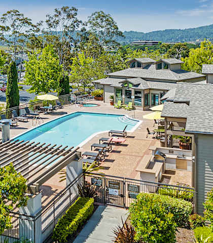 a view of the pool at the resort on a sunny day