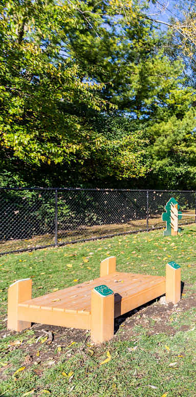 Park with a wooden bench at fifty9 Grove Apartments, Naperville, Illinois