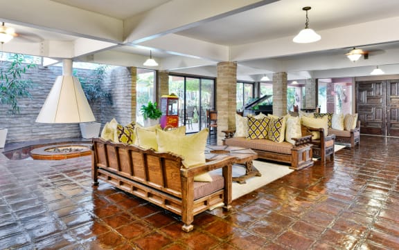 a balcony with a table and chairs and a view of the beach  at Mediterranean Village West Hollywood, West Hollywood
