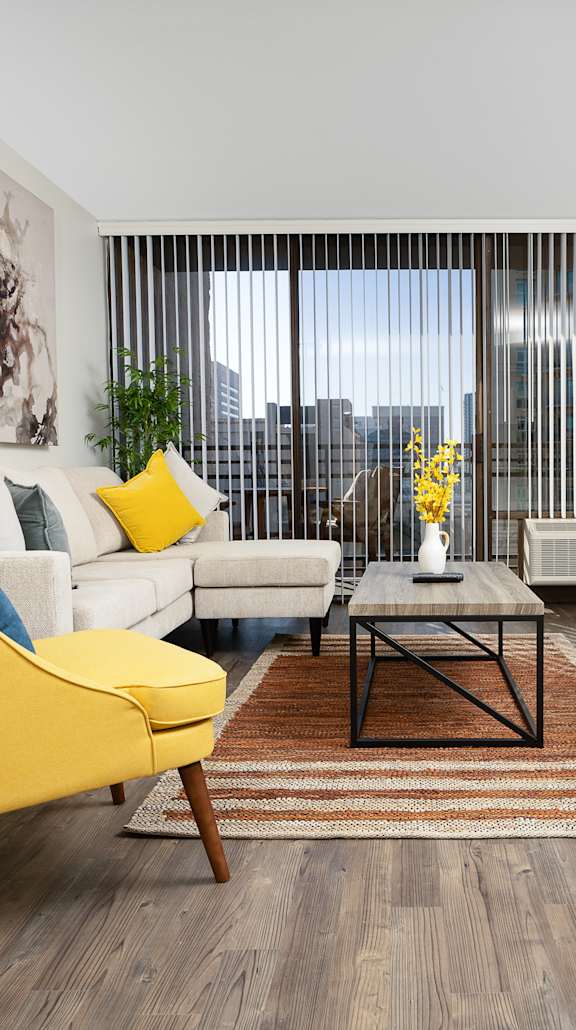 Living room with yellow chair at Vera Cortez Hill, San Diego, 92101