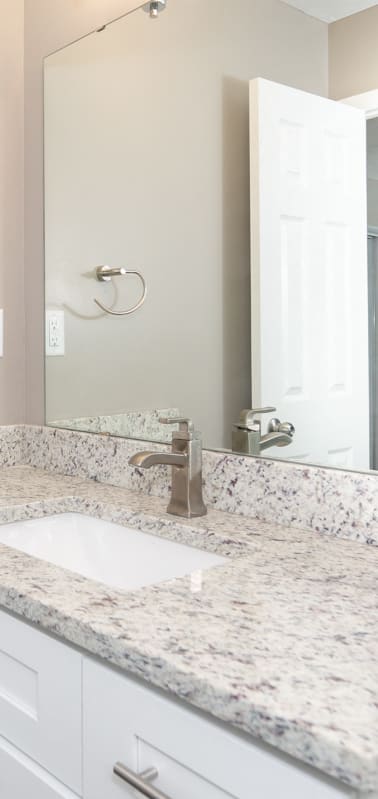 a large bathroom with a sink and a mirror