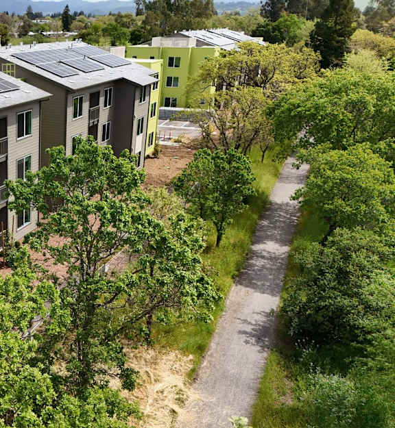 Apartment complex with solar panels on the roof.