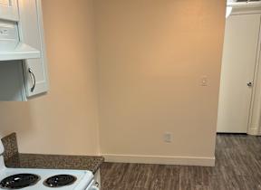 A white oven and microwave in a kitchen.