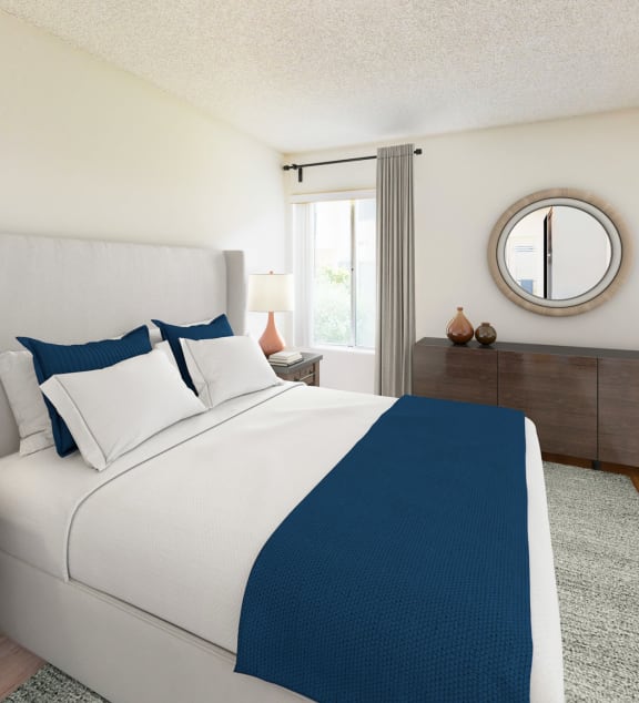 a reflection of a bedroom in a mirror in a bathroom at Village Pointe Apartments, Northridge, CA, 91325