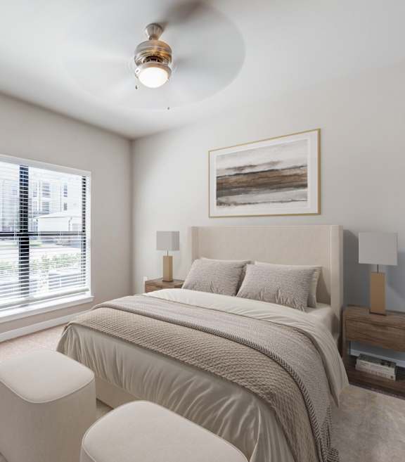 A bedroom with a large bed and a potted plant.