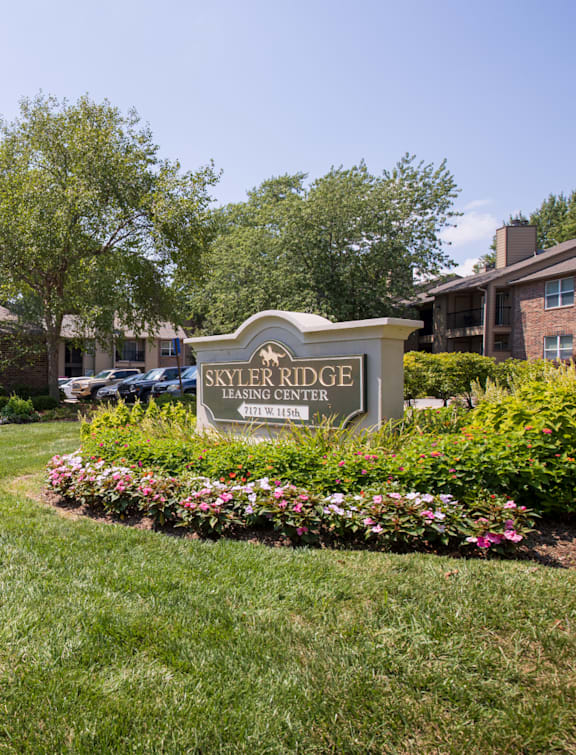 The exterior of the Skyler Ridge Clubhouse, surrounded by lush greenery and inviting landscaping.