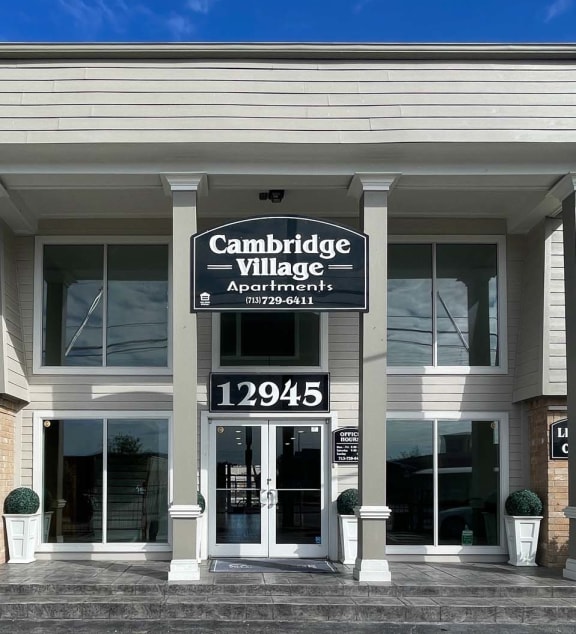 the building where the hotel is located at Cambridge Village in Houston, TX