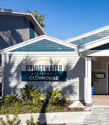 the entrance to bridgewater at gardner condos in front of a white building with