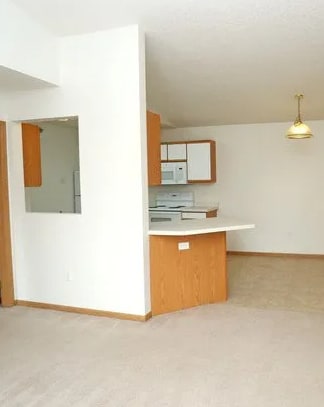 A room with a desk and a cabinet.