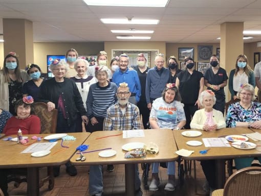 Residents and staff enjoy creating craft together at Aberdeen Heights Assisted Living