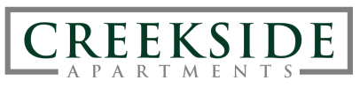 a logo with the words creekside apartments on it