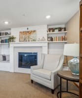 a sofa with white cushions in a living room