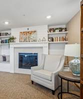 a sofa with white cushions in a living room