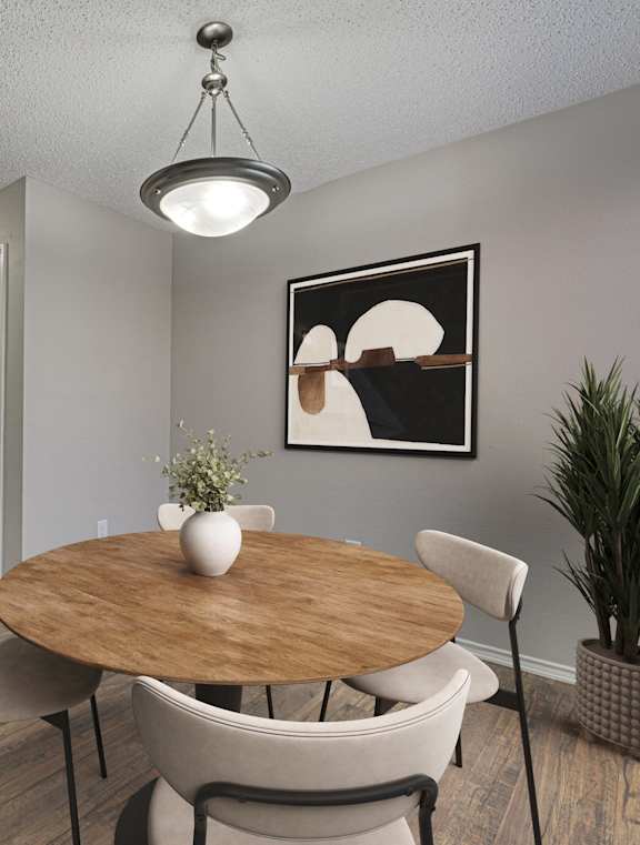A dining room with a wooden table and chairs.