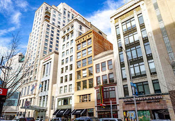 a city street with tall buildings and a blue sky in the background at 26 West, Managed by Buckingham Urban Living, 26 West Washington Street, IN