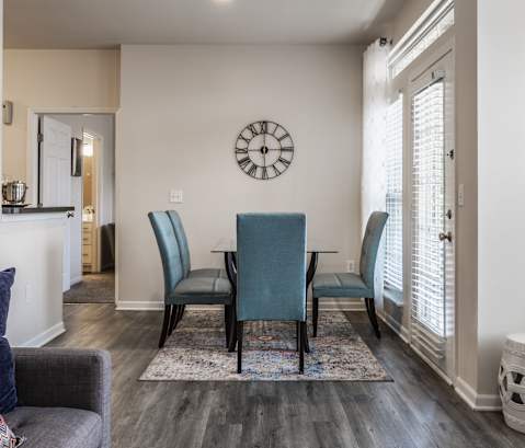 Riverchase Apartments in Indianapolis, IN - Dining Area with Wood Style Flooring
