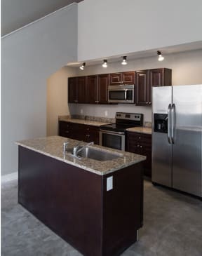 a view of the kitchen and living room from the staircase
