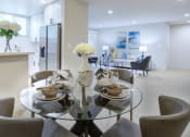 Thumbnail 10 of 17 - a kitchen and dining area in a 555 waverly unit