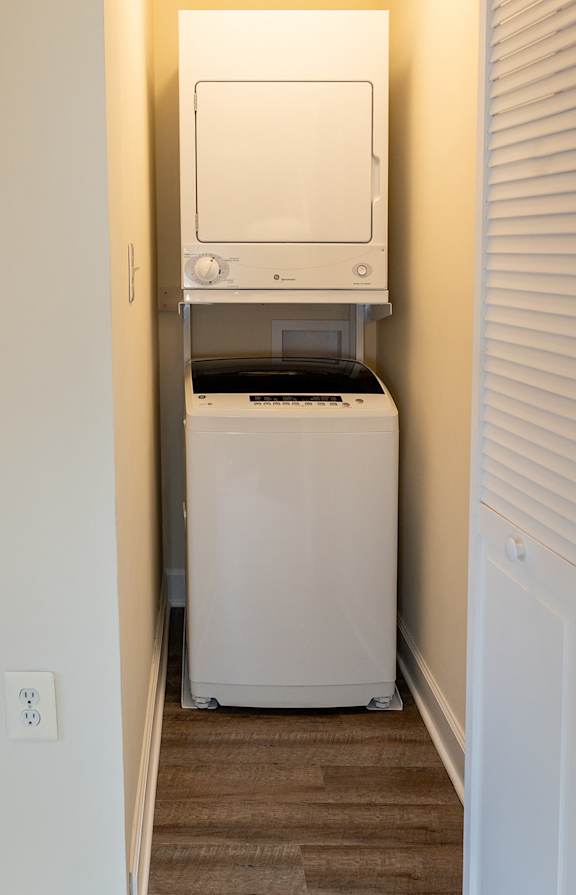 A white washer and dryer in a closet at Painters Mill Apartments, Owings Mills, 21117