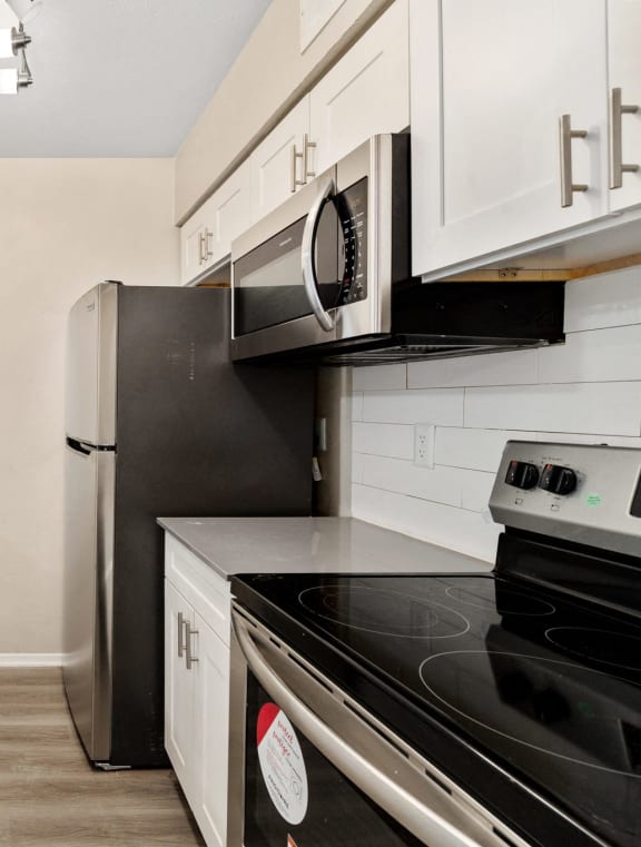 a kitchen with stainless steel appliances and a sink