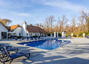 Thumbnail 9 of 15 - A pool with sun loungers and a white building in the background. at The Grove Brentwood, Nashville, TN 37211