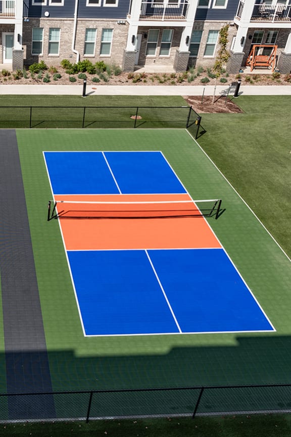 three tennis courts on a tennis court