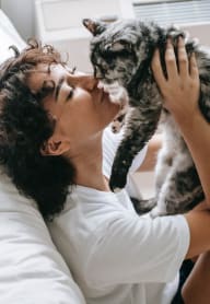 Woman Kissing Cat at The Pointe at Irving Park in Greensboro, NC 27408