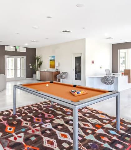 a pool table in the middle of a living room