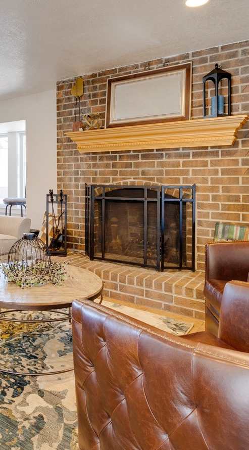 A classic living room in the clubhouse interior, featuring timeless furniture, comfortable seating arrangements, and tasteful decor, provides a welcoming and cozy communal space for residents to relax and socialize.