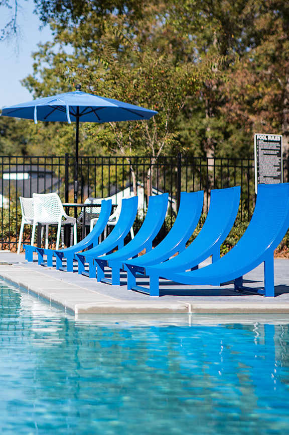 a swimming pool in front of an apartment building at sunset at Inverness Cliffs, Alabama, 35242