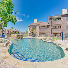 Pool with stone bench at Timberglen Apartments, Dallas