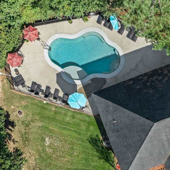 A house with a front yard and a driveway.