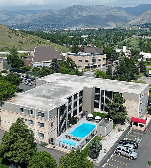 A large building with a pool in the middle of it.