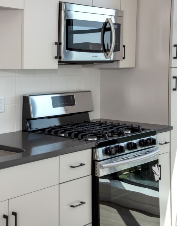Updated Kitchen With Black Appliances at The Hill Apartments, Saint Paul, MN, 55103
